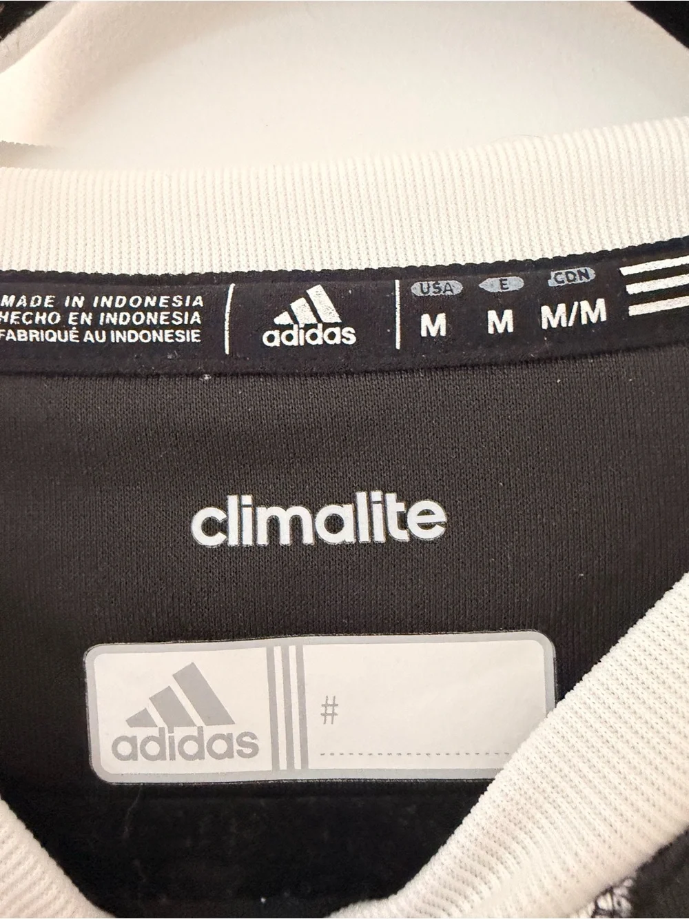 adidas Black Long-Sleeve Crew with White Trim and Orange 'T' Logo